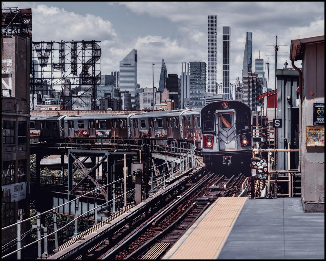 Photo of a NYC Tube Train approaching the station